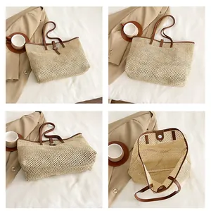 Dettaglio della grande borsa tote in paglia con finiture in pelle marrone e fibbia
