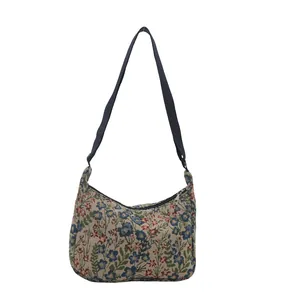 Fashion floral print tapestry hobo bag with adjustable black strap on white background