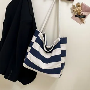 Classic navy blue and white striped canvas tote bag with rustic rope handles