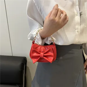 Mini red leather handbag with large bow and pearl handle for women fashion 2025