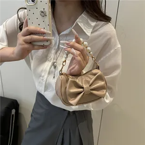 Elegant beige bow handbag with pearl handle, trendy chic mini purse for 2025 fashion style