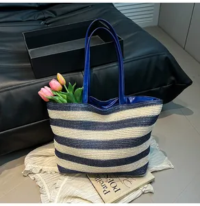 Detailed macro view of the dense woven texture and blue striped pattern on the tote bag