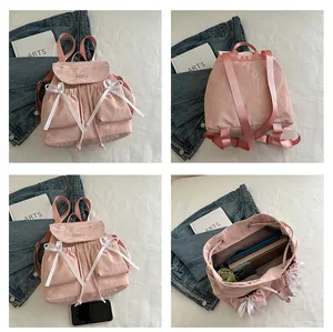 Pink casual backpack with satin bows showing front, back, and internal capacity