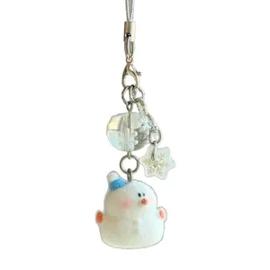 Charmant bijou de téléphone bonhomme de neige avec texture floquée et bonnet bleu