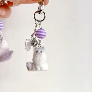 Cute fluffy white cat keychain with purple striped bead and silver metal heart charm