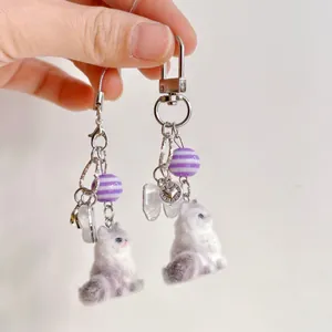 Cute fluffy cat keychain with purple beads for phone charm and handbag decoration