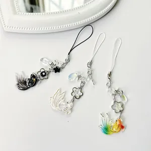 Lucky Koi star beaded phone charm set with fish pendants in black and gold colors