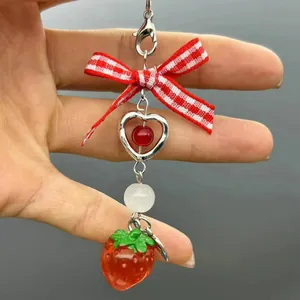 Sweet strawberry keychain with plaid bow and metal heart charm for bags and phones