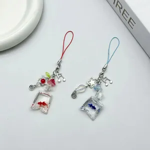 Exquisite handmade candy fish bag beaded phone chains in vibrant red and blue colors