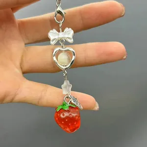 Sweet strawberry bow phone charm with silver heart and Made with Love metal tag