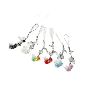Handmade koi fish beaded phone charms in six vibrant colors with metallic star accents
