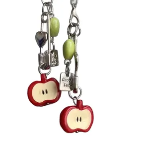 Creative fruit phone charm set with apple slice pendants and Good Luck charms