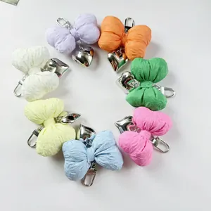 Set of 7 colorful handmade fabric bow keychains with silver heart pendants and clasps
