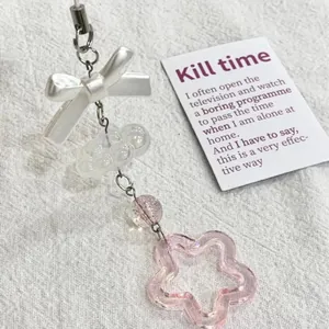 Porte-clés fait main avec nœud en perle, perle rose brillante et pendentif étoile rose