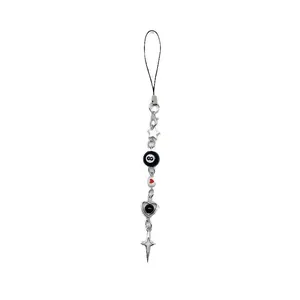Y2K handmade beaded phone lanyard with silver stars and black 8 ball charms on white background