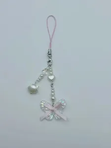 Detail of beaded phone strap with iridescent butterfly pendant and pink ribbon bow