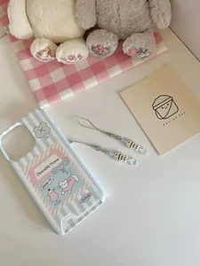 Detailed view of the cute blue striped phone case with cat illustrations and matching charms