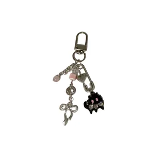 Cute black cat beaded keychain with pink beads and moon charm on a silver lobster clasp