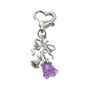 Romantic heart-shaped floral keychain with purple resin flower and metal bow details