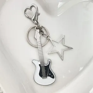 Y2K electric guitar keychain with heart carabiner and star charm in silver and black