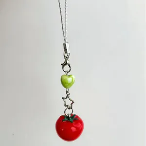 Cute tomato phone charm with green heart bead and star metal clip on a silver cord