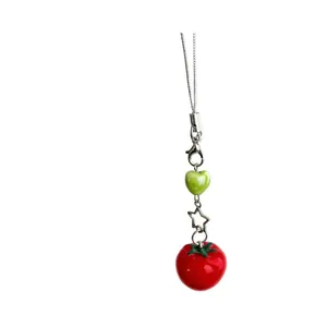 Cute red tomato phone charm with green heart bead and silver star on a delicate chain