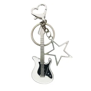 Y2K punk style guitar keychain with silver star charm and heart clasp for bags