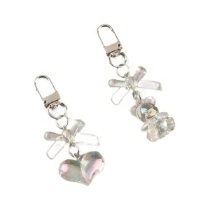 Iridescent transparent bear and heart keychains with a butterfly bow in 2-piece set