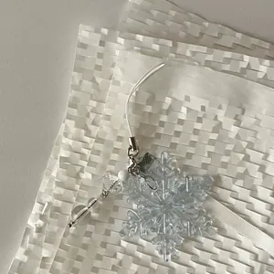 Handmade light blue snowflake beaded phone charm with transparent star and white beads