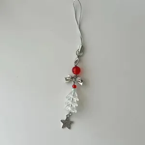 Dragonne de téléphone perlée avec sapin de Noël, nœud argenté et pendentif étoile