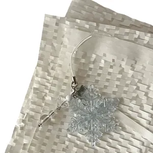 Handmade snowflake charm with transparent beads and icy crystals for winter phone decor