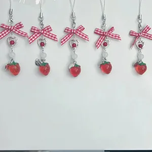 Set of five strawberry bow charms with red checkered ribbons and heart pendants