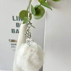 Cute white pompom phone chain with silver snowflake pendant and crystal bead