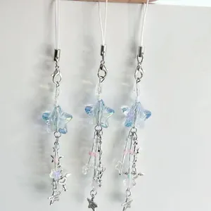 Set of three iridescent star phone charms with colorful beads and metal heart pendants