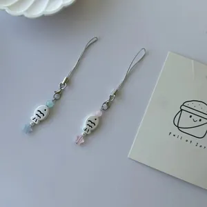 Cute pink and blue fish pendants with stars for phone straps or keychains