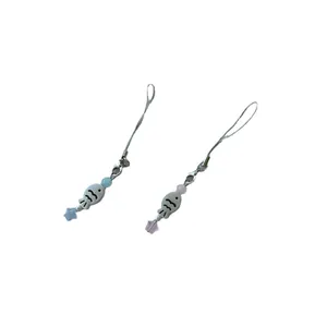 Cute fish and star phone charms with colorful beads and silver metal clasps on white background