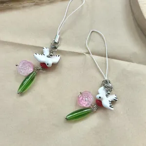 Minimalist bird and flower phone charm set with white ceramic bird and pink rose beads