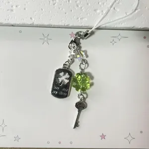 Lucky clover phone strap with silver heart key charm and You Are My Lucky metal pendant