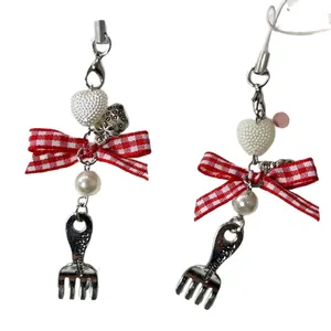 Pastel heart and bow beaded phone charm with strawberry and mini fork pendants
