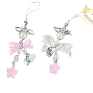 Pink and white Y2K beaded phone charms with stars and satin ribbons in a two-piece set