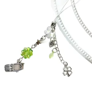 Lucky four-leaf clover phone charm with silver mini phone model and Y2K star beads