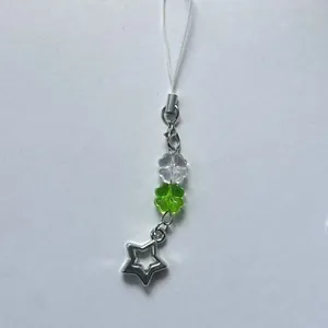 Green and white beaded lucky star phone strap and keychain with clover charms