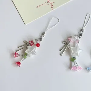 Handgemaakte kralenhangers met sterren en bloemen voor mobiele telefoons met vlinderhanger
