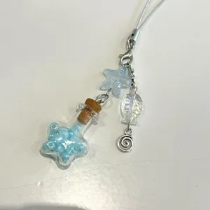 Colgante móvil de botella con estrella de mar azul y cuenta de resina en estrella