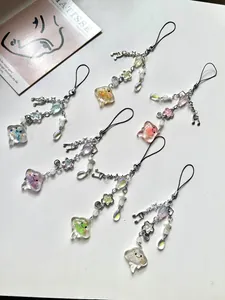 Flat lay of six creative jellyfish charms with music notes and stars on a white base