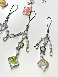 Detailed view of handmade beaded jellyfish charms with resin pendants and star accents