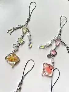 Detail of handmade jellyfish keychains with colorful resin charms and beaded chains