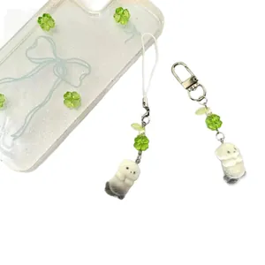 Cute sea otter beaded phone charm with green clover and pearl beads on clear case
