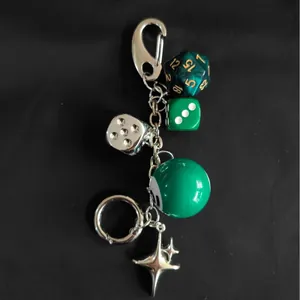 Vintage green and silver dice bag charm featuring metal star pendant and billard ball link
