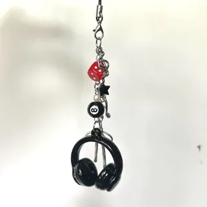 Y2K punk phone charm with headphone pendant, black 8-ball and star on silver chain